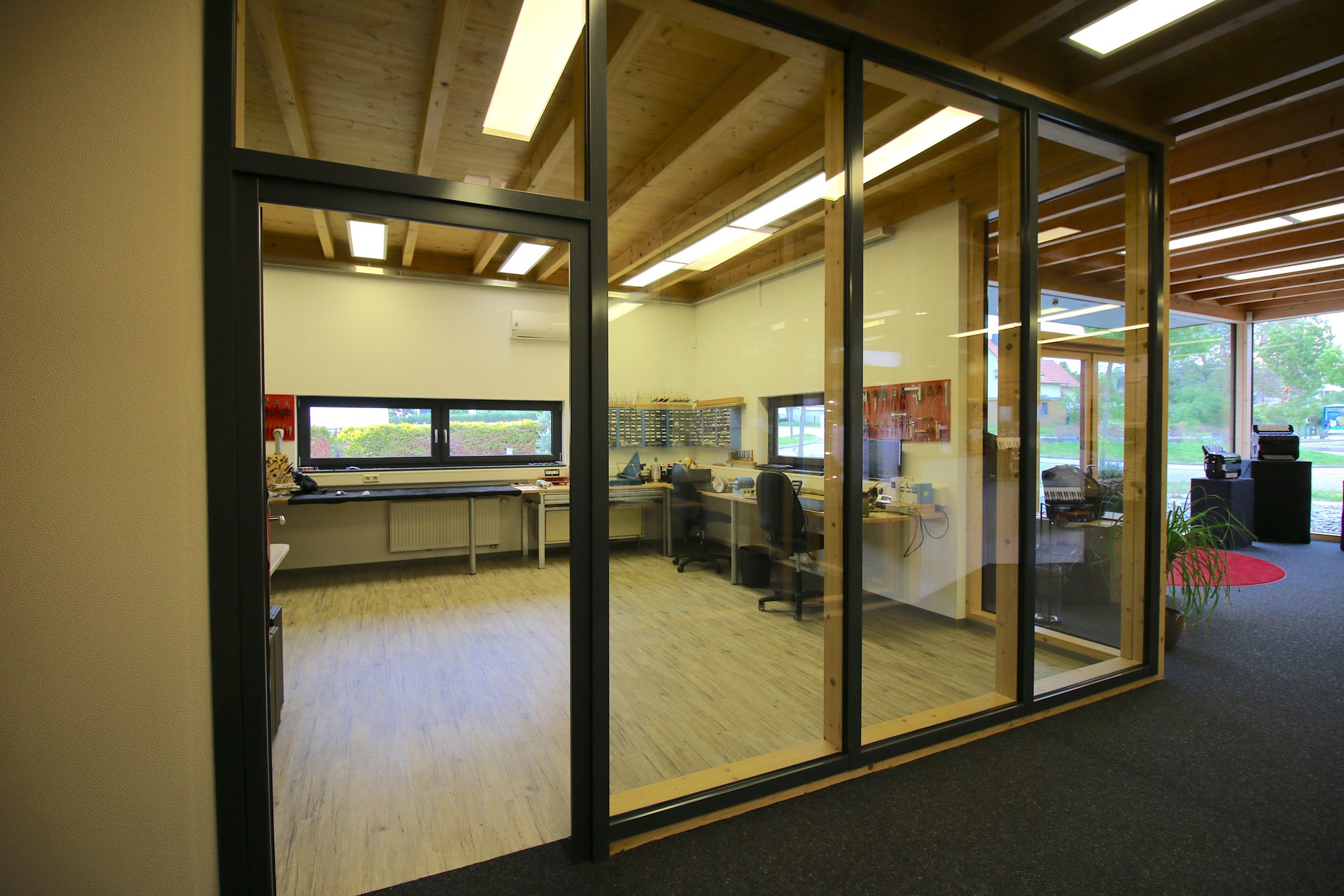 A view through the glass wall into the accordion workshop